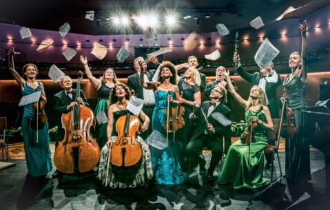 Orchestra players throw sheet music Orchestra players throw sheet music